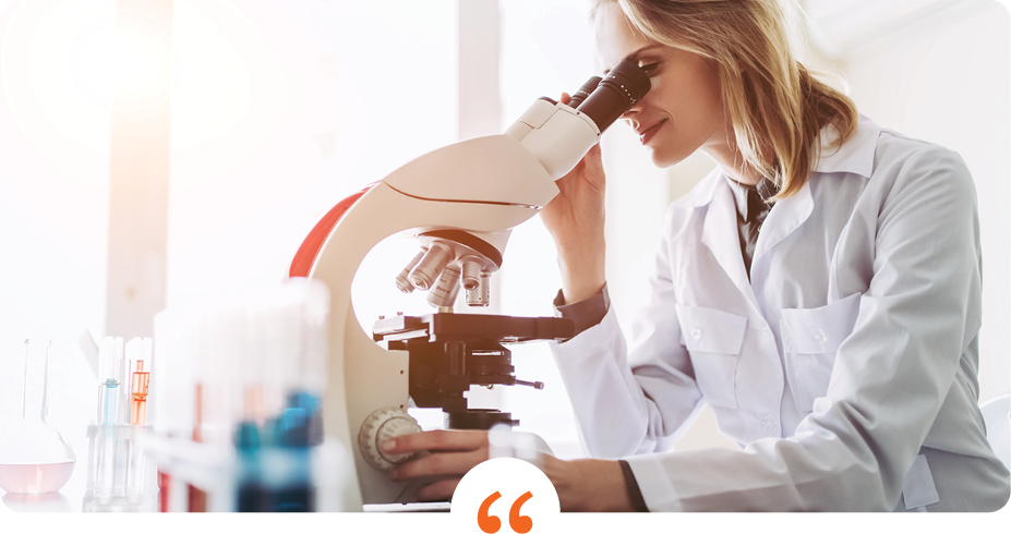 woman in a white labcoat looking through a microscope with orange quotation marks centered at the bottom